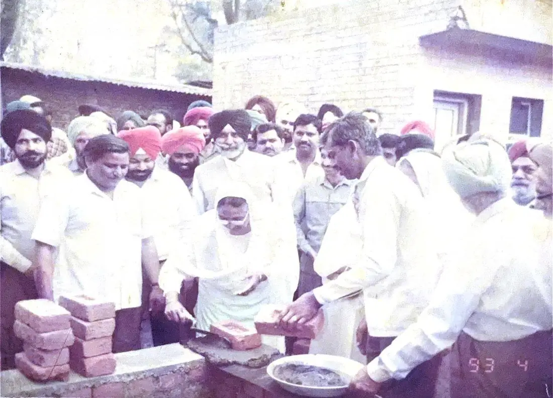 Laying the foundation stone of a community building at Dera Bassi, 1993