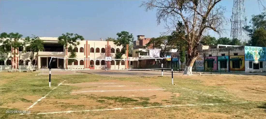 Volleyball and basketball courts in front of the school block